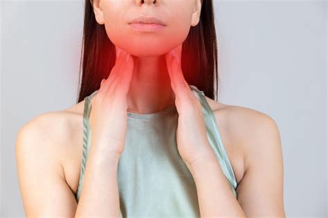 Premium Photo | Sore throat in flu season Young asian woman touching