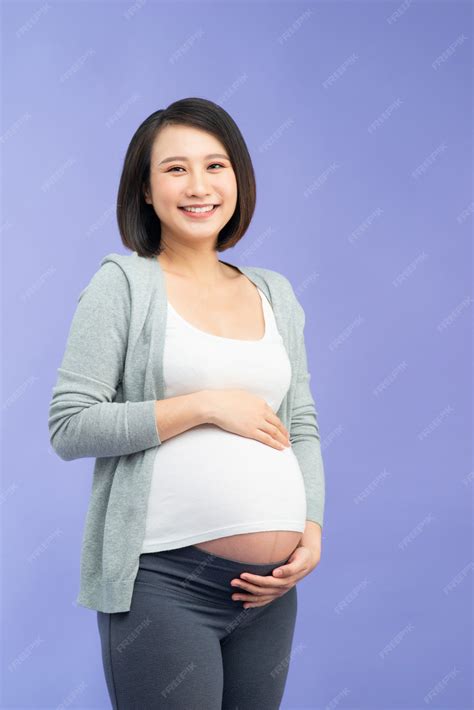 Premium Photo | Young pretty asian pregnant woman