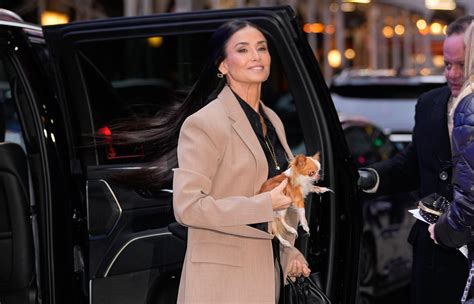Demi Moore Posing in White Go-Go Boots With a Tiny Dog Is an Eternal