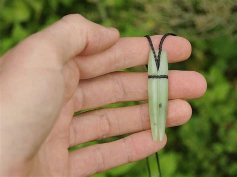 light pounamu rolled leaf  carved piece pounamu