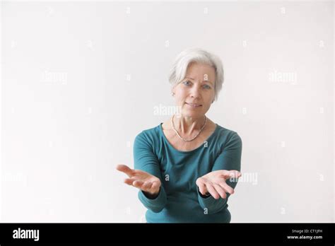 older woman reaching  stock photo alamy