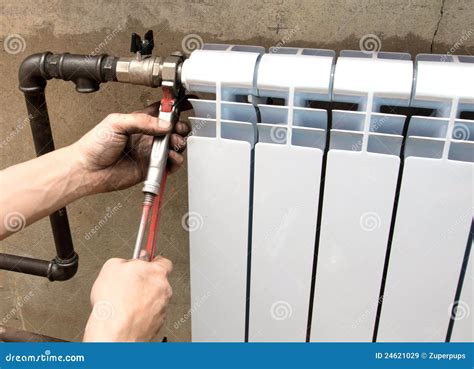 Installation of a radiator stock image. Image of natural - 24621029