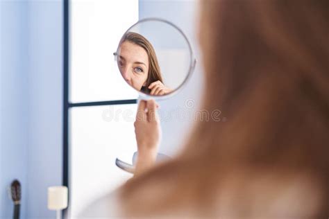 young woman smiling confiden   mirror  bedroom stock photo