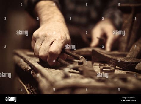 cobbler at work with old tools Stock Photo - Alamy