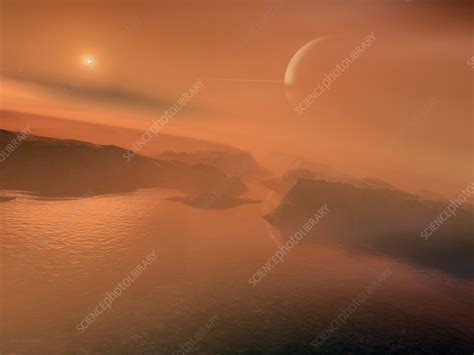 Titan surface with Saturn in sky, illustration - Stock Image - C059 ...