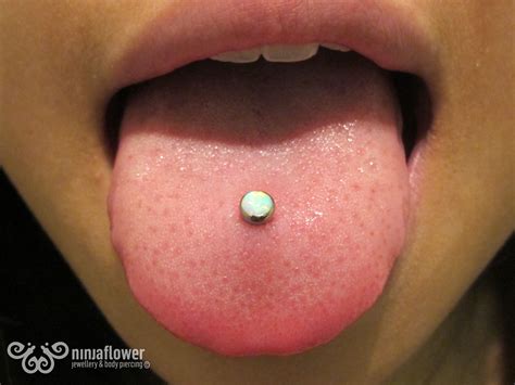 Tongue piercing with white opal cab