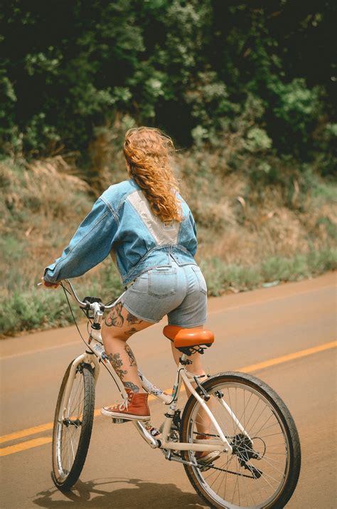 Woman Riding White Bicycle · Free Stock Photo