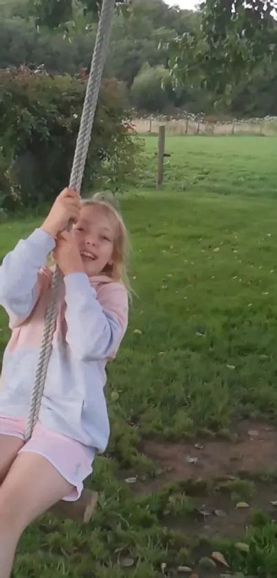 child swinging  sunny field