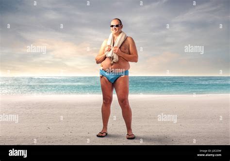 Fat man standing on the beach Stock Photo: 139221541 - Alamy