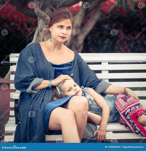 Mother and Daughter in a Park Stock Photo - Image of park, laying