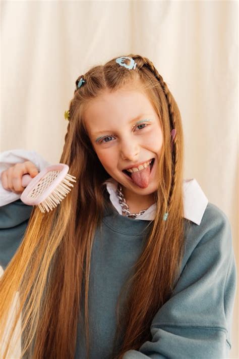 girl brushing  hair  stock photo
