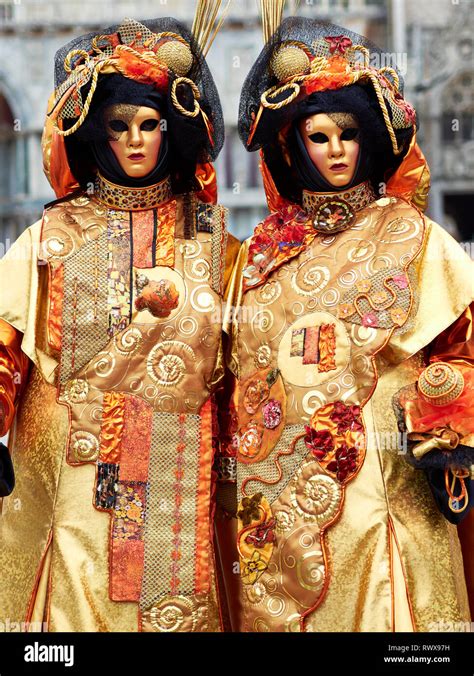 Italy carnival masked costume in gold hi-res stock photography and ...