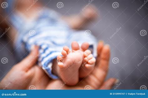 Newborn Baby Feet. Cute Feet of Sleeping Baby Stock Image - Image of ...