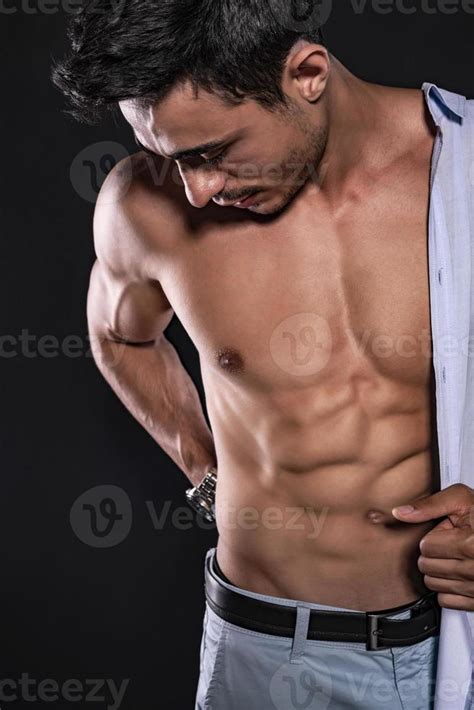 handsome arab male model  perfect body posing  studio portrait