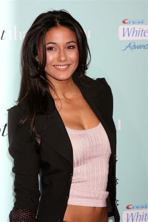 Emmanuelle Chriqui arriving at the Premiere of Hes Just Not That Into