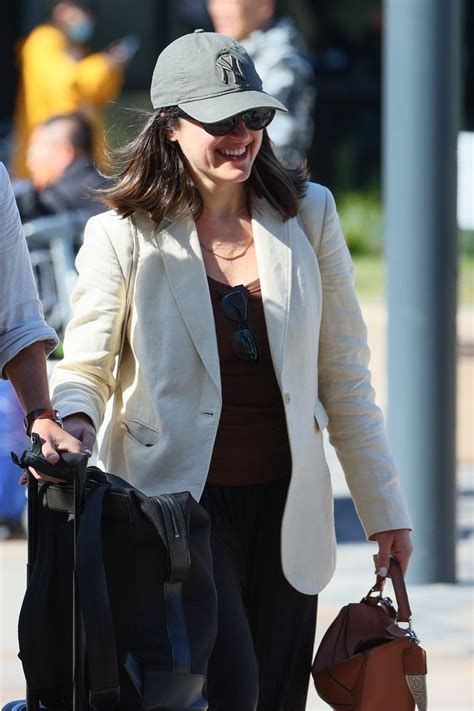 Sarah Abo and Husband Cyrus Moran at Sydney Airport 08/27/2023 • CelebMafia