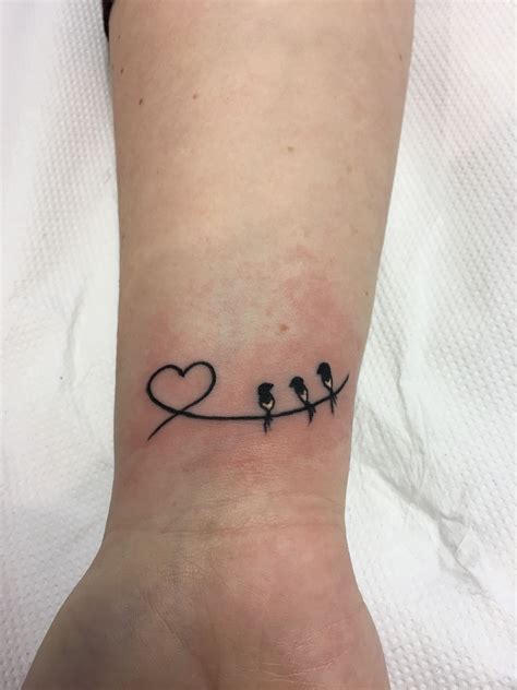 heart on wrist tattoo 8