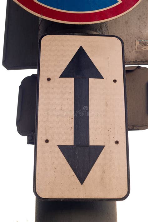 Road Sign Double Arrow Close-up on the Street. Stock Image - Image of drive, warning: 255769801