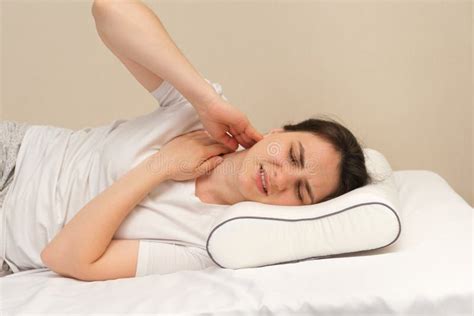 A Woman Has a Sore Neck after Sleeping on the Wrong Uncomfortable Pillow Stock Photo - Image of ...