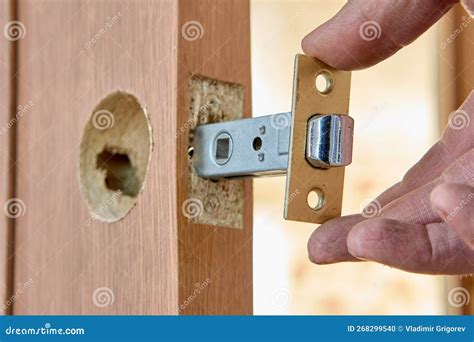 Installing Door Latch in Slot of Interior Door. Stock Photo - Image of ...