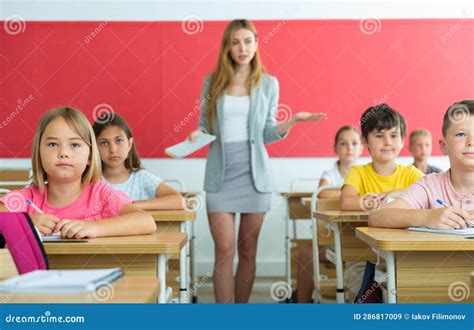 Kids listening to teacher stock image. Image of children - 286817009