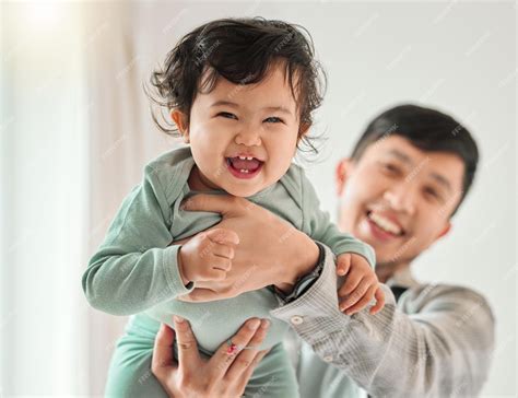 Premium Photo | Asian dad portrait smile and baby for bonding together