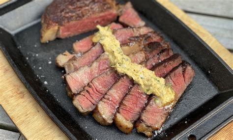 Smokey Skies And Sizzling Skillets: A Steakhouse Guide To Cooking Cowboy Ribeye Perfection