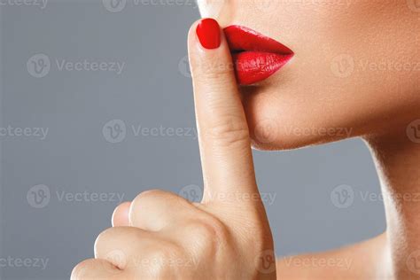 Woman is showing shush or silence gesture 16199993 Stock Photo at Vecteezy