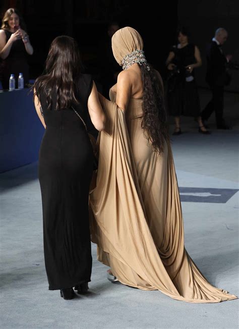 Kim Kardashian Completely Covers Her Face in Dramatic Nude Corset Gown