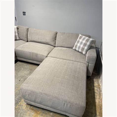 Raylin Fabric Sectional with Ottoman - AptDeco