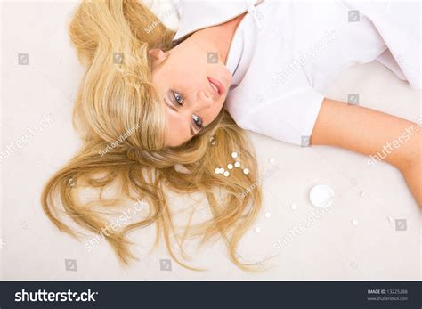 beautiful dead girl  tablets   floor stock photo