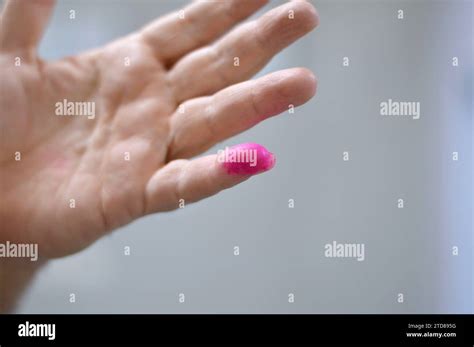 Cairo, Egypt, December 12 2023: A voter hand stained with election ink ...