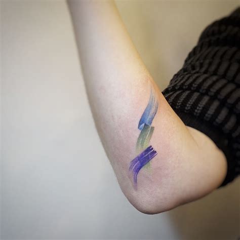 Watercolor brushstroke tattoo by tattooist G.NO - Tattoogrid.net