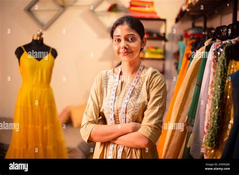 confident Young indian woman fashion designer standing crossed arms ...