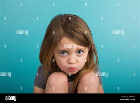 Little girl pouting Stock Photo - Alamy