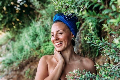 Premium Photo | Headshot of a young woman laughing outdoors. real emotions.