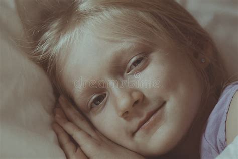 Little girl lying in bed stock image. Image of kids - 255519389