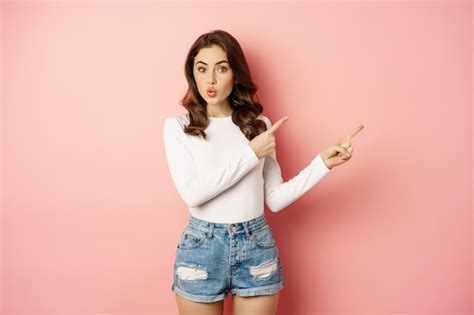Premium Photo | Portrait of intrigued stylish girl showing interest in ...