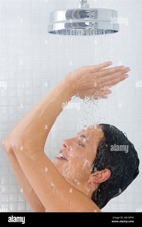 Woman showering hi-res stock photography and images - Alamy