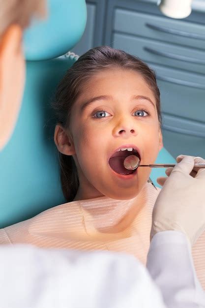 premium photo dentist child patient exam examination dentists chair