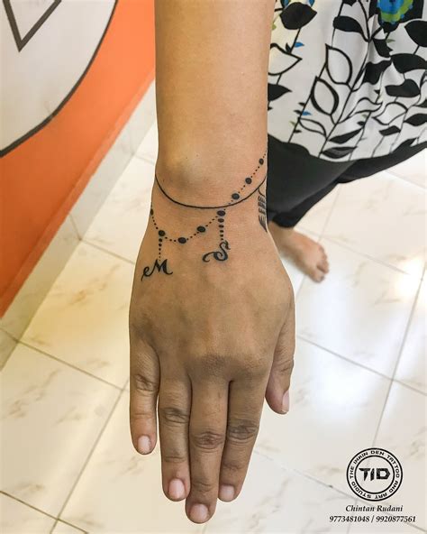Tattoos of flowers on wrist meanings you need to know first 14
