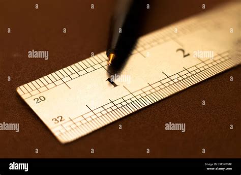 close    stainless steel scale  ruler showing    point