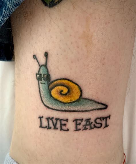 Cool little snail from Chad Norris at AAA Tattoo in Lafayette