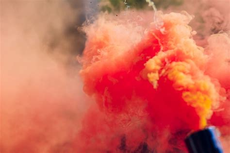 Premium Photo | Colorful red smoke bombs in action