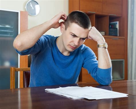 photo man fills  financial documents