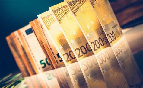Premium Photo | Euro bills on reflective table