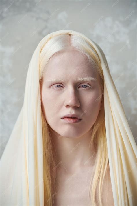 Premium Photo | Young serene albino woman with white cover on head