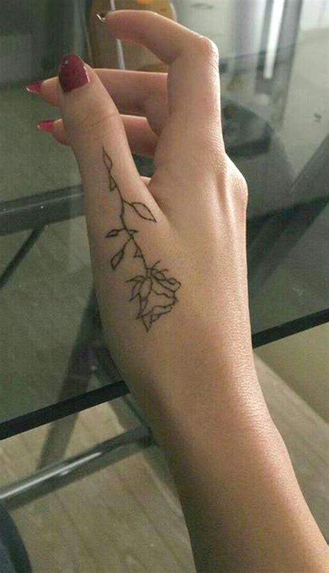 simple flower hand tattoo