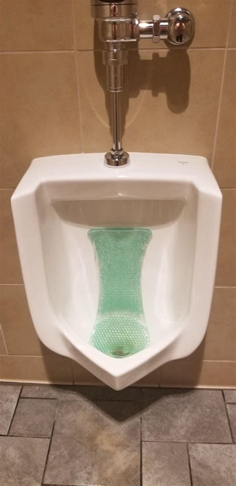 This urinal freshener that eliminates splash back : r/mildlyinteresting