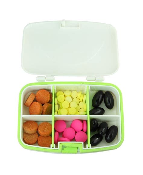 comprimidos  vitaminas em uma caixa azul  comprimido imagem de stock